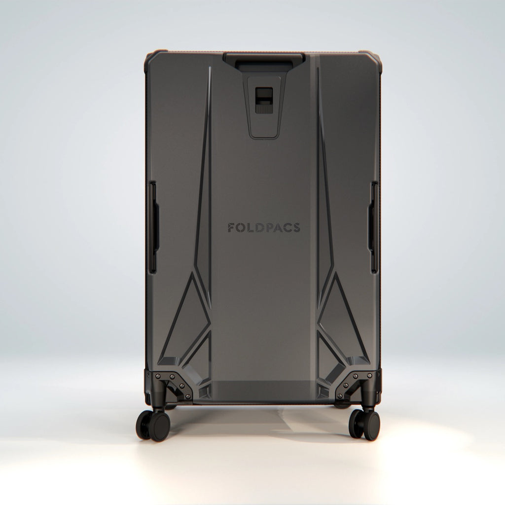 Anthracite FOLDPACS suitcase standing upright, full rear view with frame structure