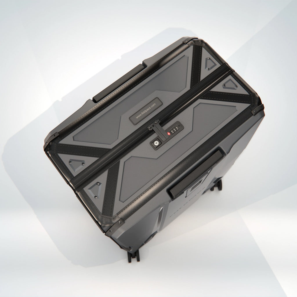 Anthracite FOLDPACS hard-shell suitcase closed, seen from above at an angle