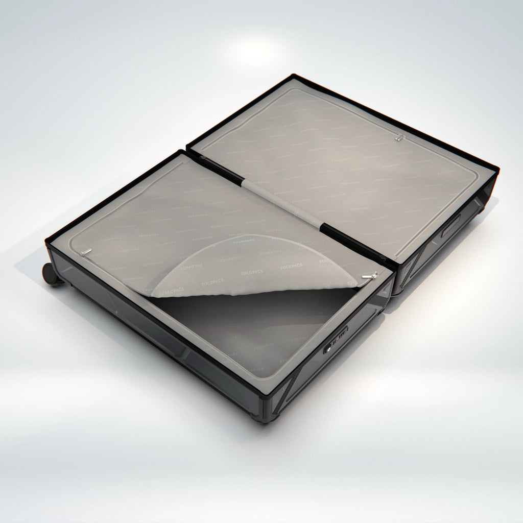 Anthracite FOLDPACS suitcase opened flat, grey lined interior seen from above