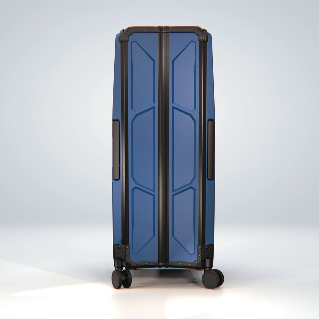 Navy FOLDPACS suitcase standing upright, front view of the ribbed shell
