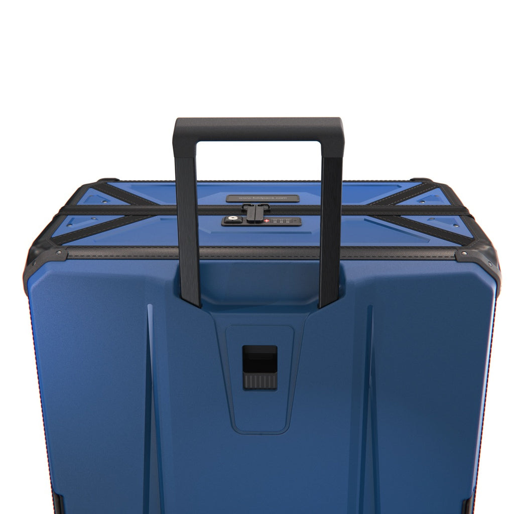 FOLDPACS suitcase in navy with the telescopic handle extended, rear view